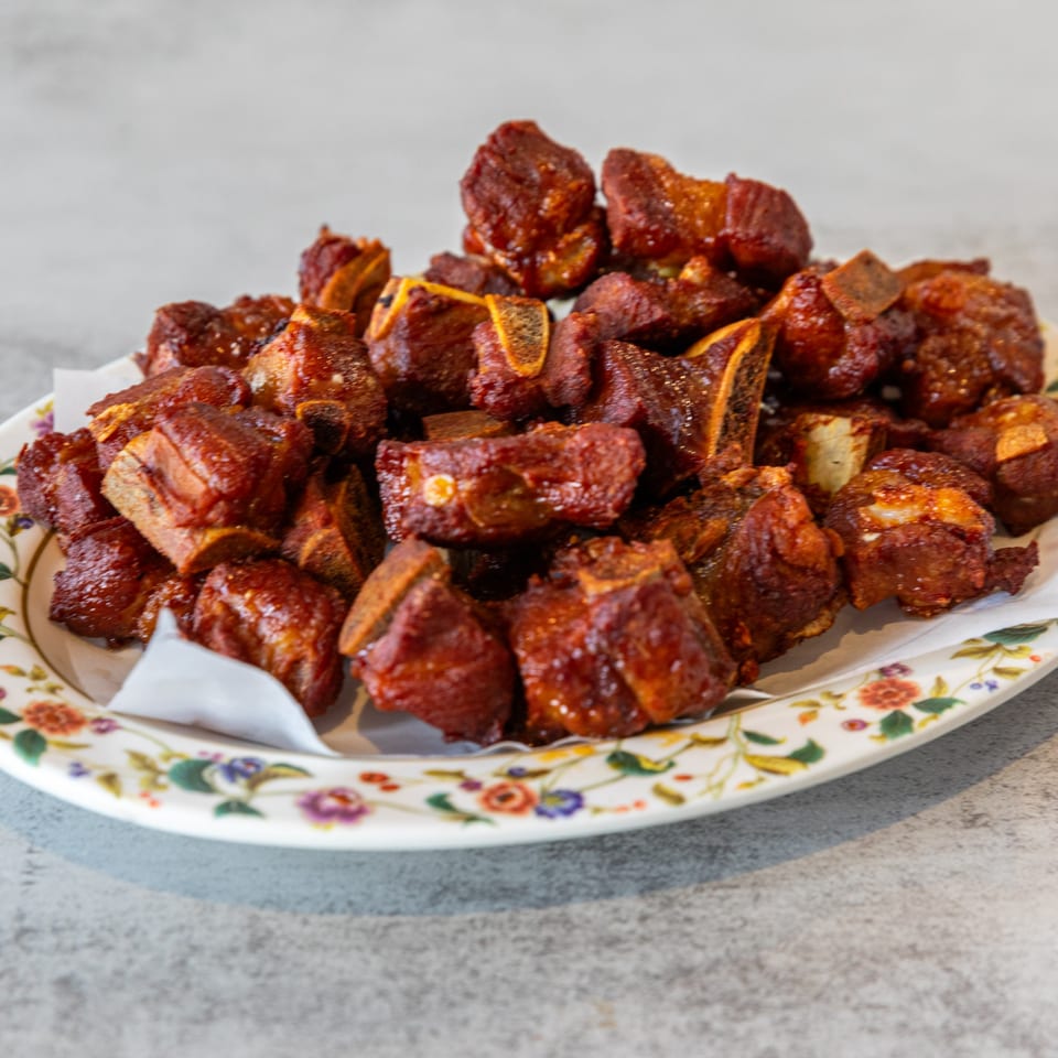 A platter of crispy, glazed pork ribs, a popular dish at Pho Lao Vieng.