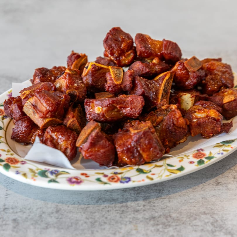 A platter of crispy, glazed pork ribs, a popular dish at Pho Lao Vieng.